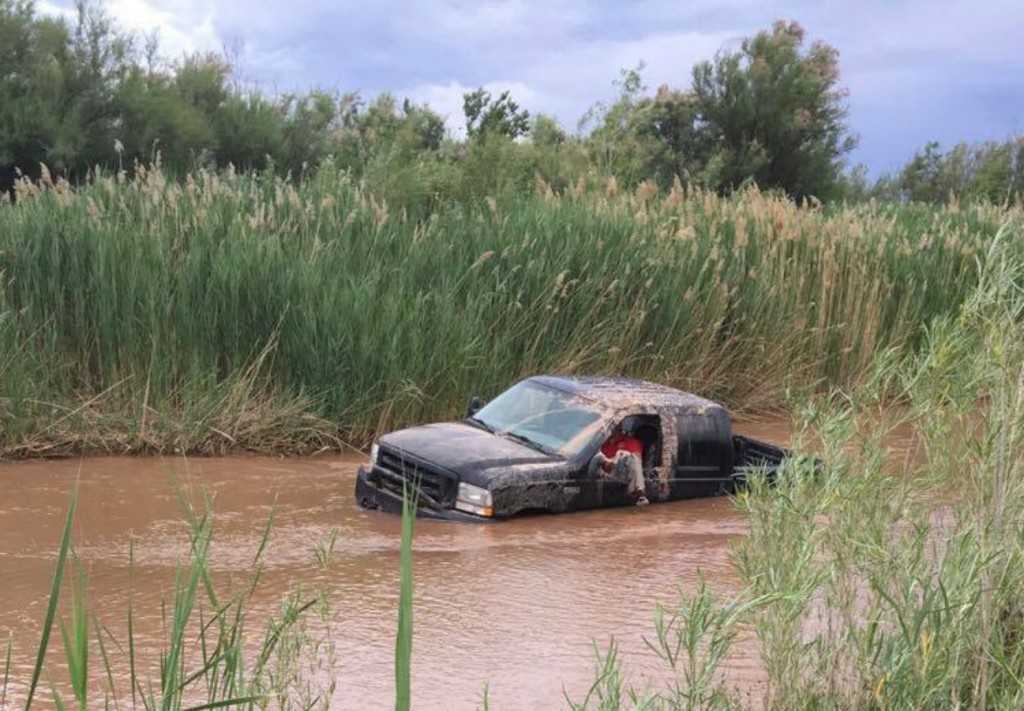 A joyride into the Virgin River ended abruptly when the truck dropped into a large hole and got struck, St. George, Utah, May 17, 2016 | Photo courtesy of Elise Marie Tuttle, St. George News