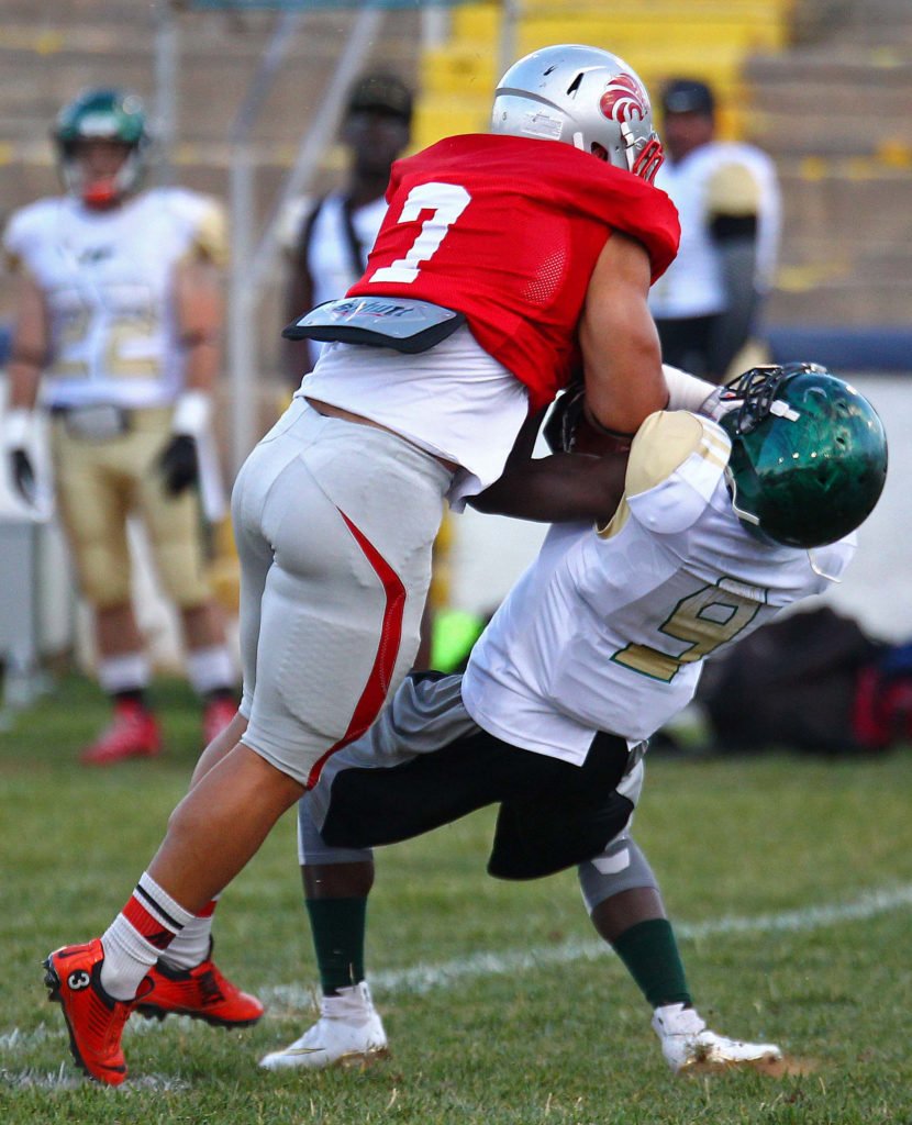 Zion Lions' Isaac Katoa (7) makes a big hit on a Trojan ball carrier, Zion Lions vs. Vegas Trojans, Football, June 18, 2016, | Photo by Robert Hoppie, ASPpix.com, St. George News