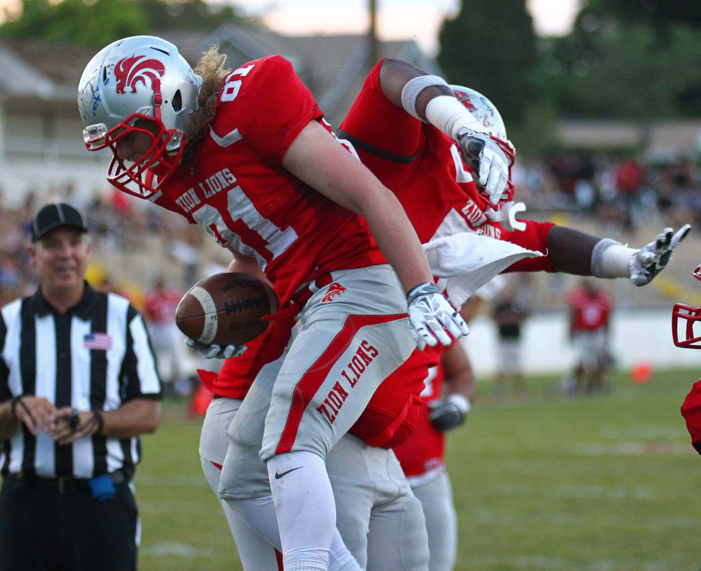 Zion Lions' Bailey Glass (81) scores a touchdown, Zion Lions vs. Vegas Trojans, Football, June 18, 2016, | Photo by Robert Hoppie, ASPpix.com, St. George News