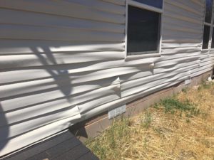 A fire Sunday afternoon melted the siding on one home and threatened others, Enoch, Utah, June 5, 2016 | Photo by Tracie Sullivan, St. George News