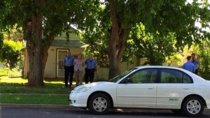 Police escort a Washington City man to a patrol car after deploying a TASER on the man and arresting him on a first-degree felony count of aggravated kidnapping, 200 S. Main Street, St. George, Utah, June 3, 2016 | Photo by Kimberly Scott, St. George News