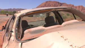 A car sits at the side of the road after the driver rolled it, Santa Clara, Utah, June 14, 2016 | Photo by Ric Wayman, St. George News