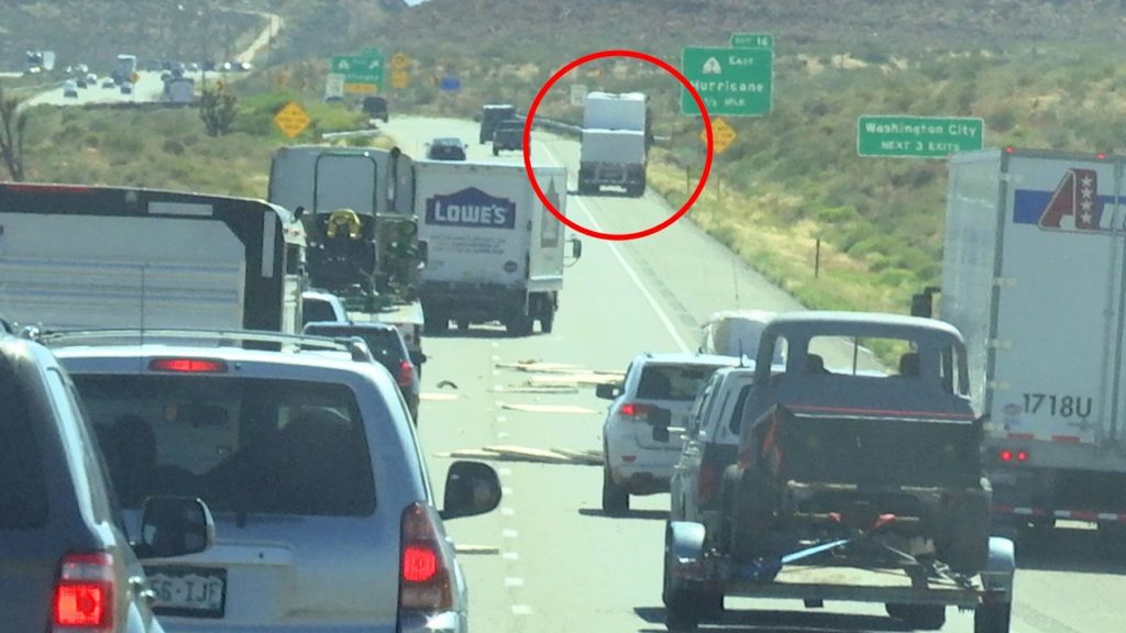 Flatbed semitrailer pulled over after realizing part of the load blew off trailer, shown here in the distance, Interstate 15 southbound lanes, Washington County, Utah, June 15, 2016 | Photo by Austin Peck, St. George News