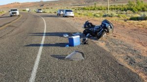 A motorcycle lays on the ground after a car made a U-turn in front of it Monday evening. Hurricane, Utah, June 6, 2016 | Photo courtesy of Sgt. Brandon Buell, St. George News