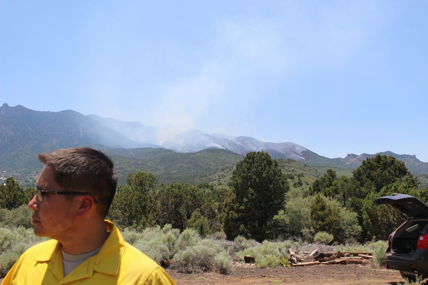 Smoke rises from the Saddle Fire in the background as Incident Commander Chris Henrie addressed members of the media, Pine Valley, Utah, June 20, June 20, 2016 | Photo by Mori Kessler, St. George News