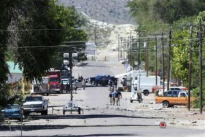 Police investigate shrapnel from a Wednesday night bombing that killed one person on 5th Street in Panaca, Nev., on Thursday, July 14, 2016 | Brett Le Blanc/Las Vegas Review-Journal via AP, St. George News