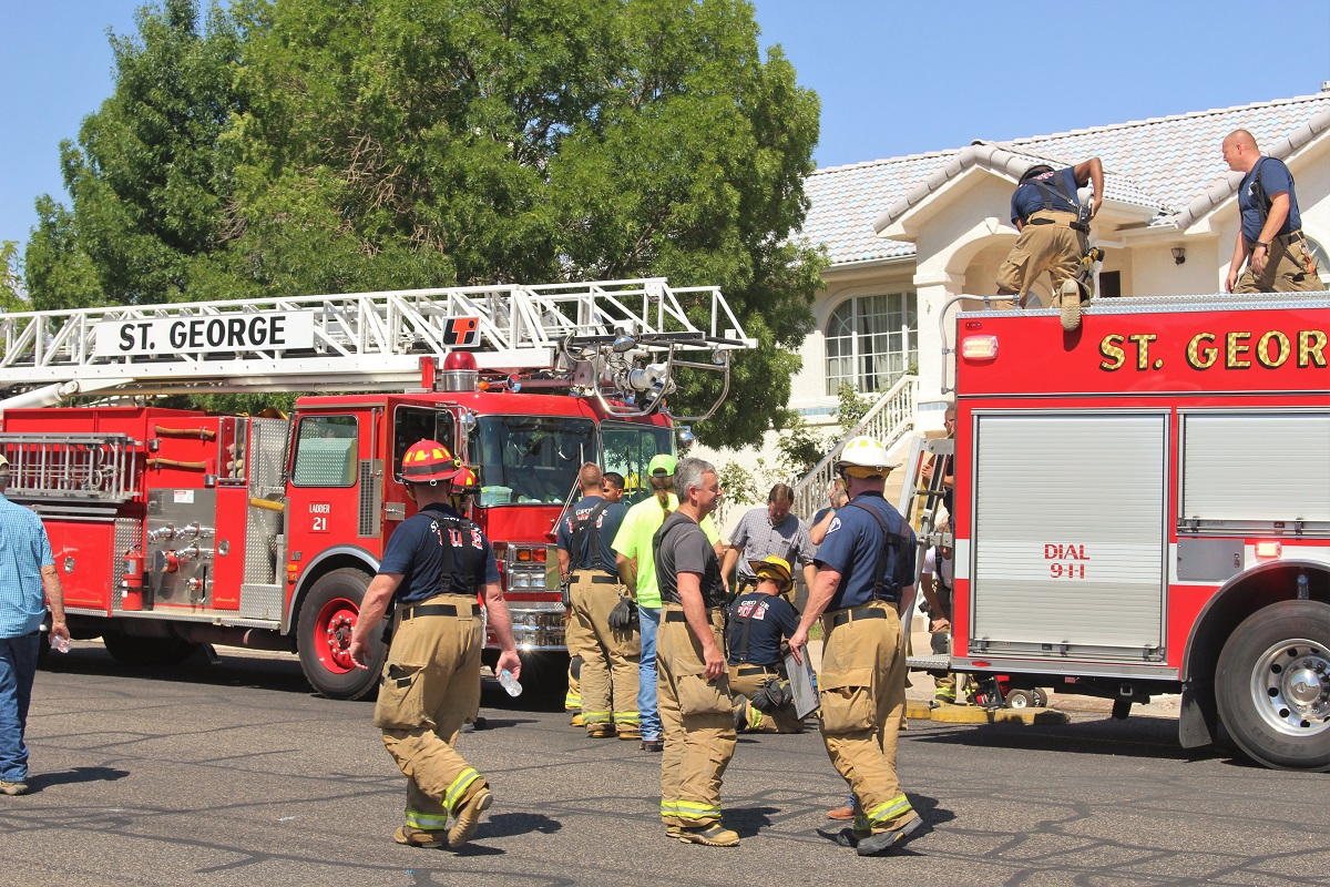 Emergency personnel in front of residence where second story deck caught fire possibly from a barbecue, 100 block of 2000 East, St. George, Utah, July 27, 2016 | Photo by Cody Blowers, St. George News