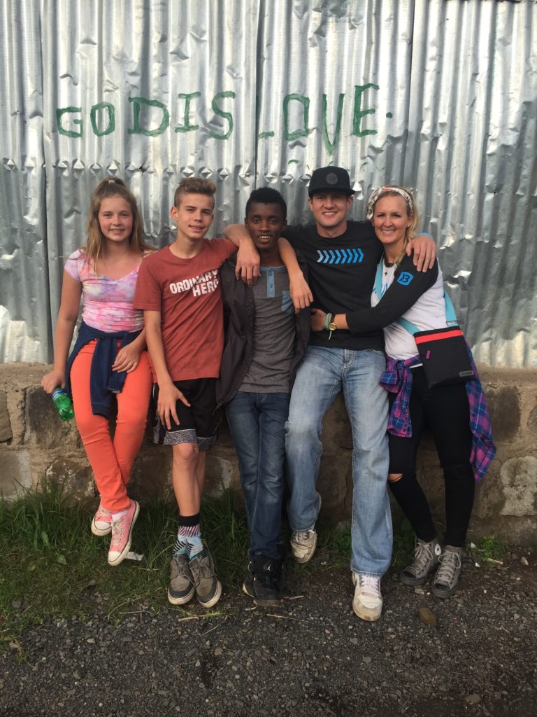  Brandon and Darci Burke (right) and their two oldest children (left) along visit Ethiopia and meet with Kai (middle), May, 2016 | Photo courtesy of Darci Burke, St. George News