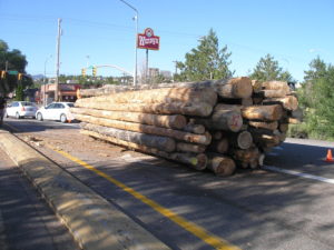 Log truck spills load blocking northbound on and off ramps, Exit 59 Interstate 15, Cedar City, Utah, July 15, 2016 | Photo courtesy of Utah Highway Patrol