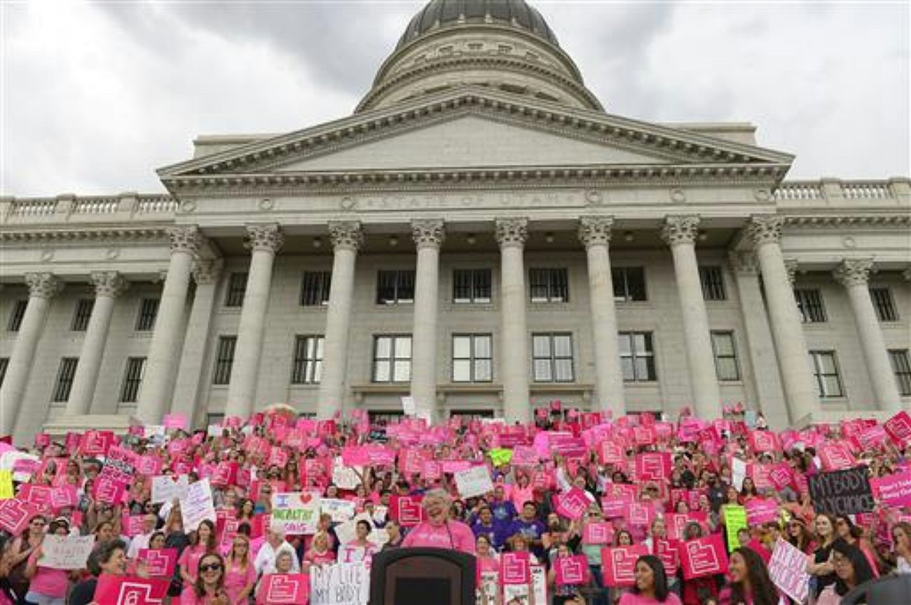 FILE - This Aug. 25, 2015, file photo, Karrie Galloway, CEO of Planned Parenthood Action Council, laughs as the roar of the crowd drowns out her speech at the state Capitol, in Salt Lake City. A federal appeals court is ordering Utah to continue sending money to the state branch of Planned Parenthood, overturning an earlier ruling that allowed the governor to defund the organization, Salt Lake City, Utah, Aug. 25, 2015 | Photo by Leah Hogsten/The Salt Lake Tribune via The Associated Press, St. George News