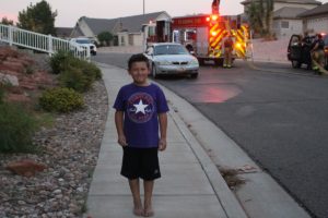 Cassius Sanchez alerted his father to the fire in residential neighborhood stated by fireworks, St. George, Utah, July 24, 2016 | Photo by Cody Blowers, St. George News