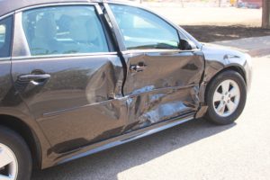 Dark Blue Chevrolet 4-door involved in collision on 100 South and 400 East where two people were injured , St. George,Utah, July 24, 2016 | Photo by Cody Blowers, St. George News
