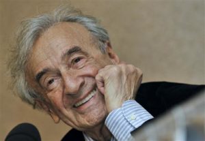 In this file photo, Elie Wiesel smiles during a news conference. Wiesel, the Nobel laureate and Holocaust survivor has died. His death was announced July 2, 2016 by Israel's Yad Vashem Holocaust Memorial. Budapest, Hungary, December 10, 2009 | File photo by Bela Szandelszky (AP), St. George News