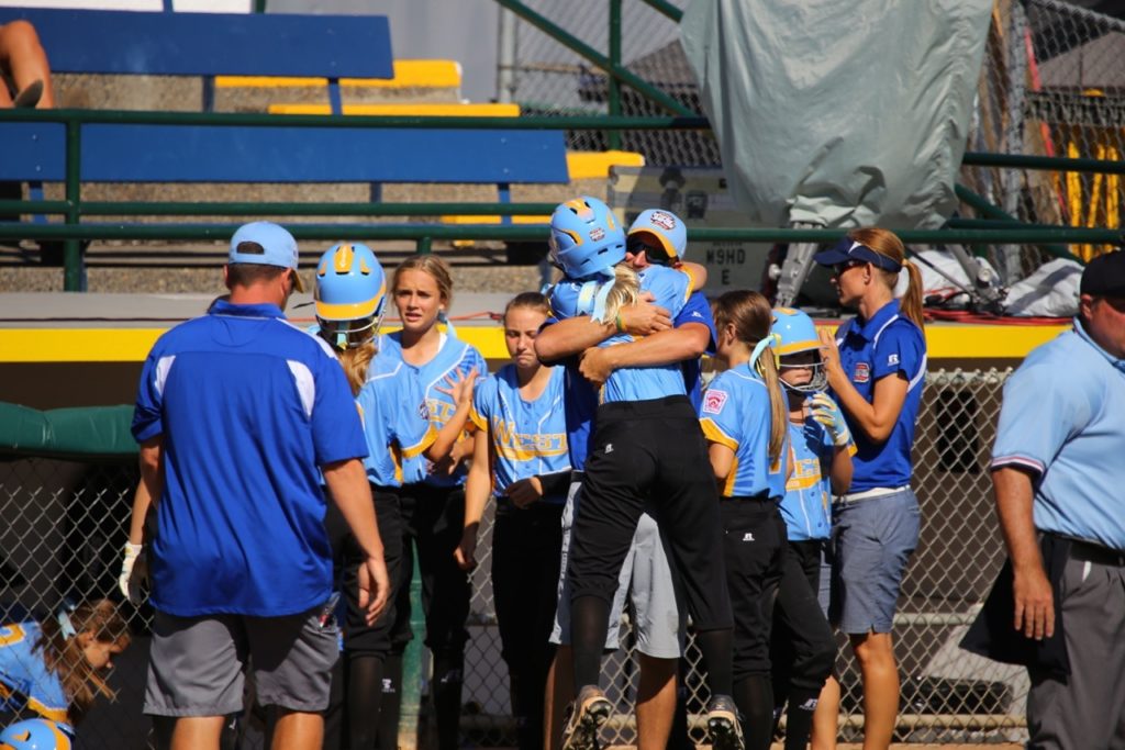 Hugs after scoring a run at the Little League Softball World Series, Snow Canyon vs. Netherlands, Portland, Ore., Aug. 17, 2016 | Photo by Scott Miller, special to St. George News 