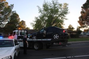 Black Volkswagen Jetta on tow truck after rollover in Santa Clara Sunday evening, Santa Clara, Utah, Aug. 14, 2015 | Photo by Cody Blowers, St. George News