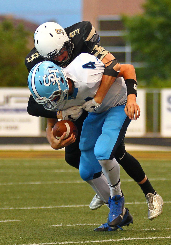 Desert Hills’ Carter Reynolds (9) sacks the Salem Hills quarterback, Desert Hills vs. Salem Hills, Football, St. George, Utah, Aug. 26, 2016, | Photo by Robert Hoppie, ASPpix.com, St. George News