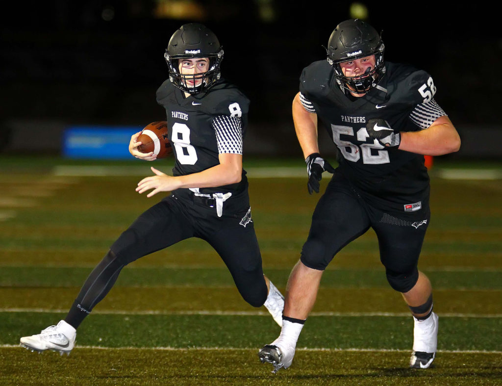 Pine View's Tyler Heaton (52) leads the way for Jacob Brann (8), Pine View vs. Uintah, Football, St. George, Utah, Aug. 26, 2016, | Photo by Robert Hoppie, ASPpix.com, St. George News