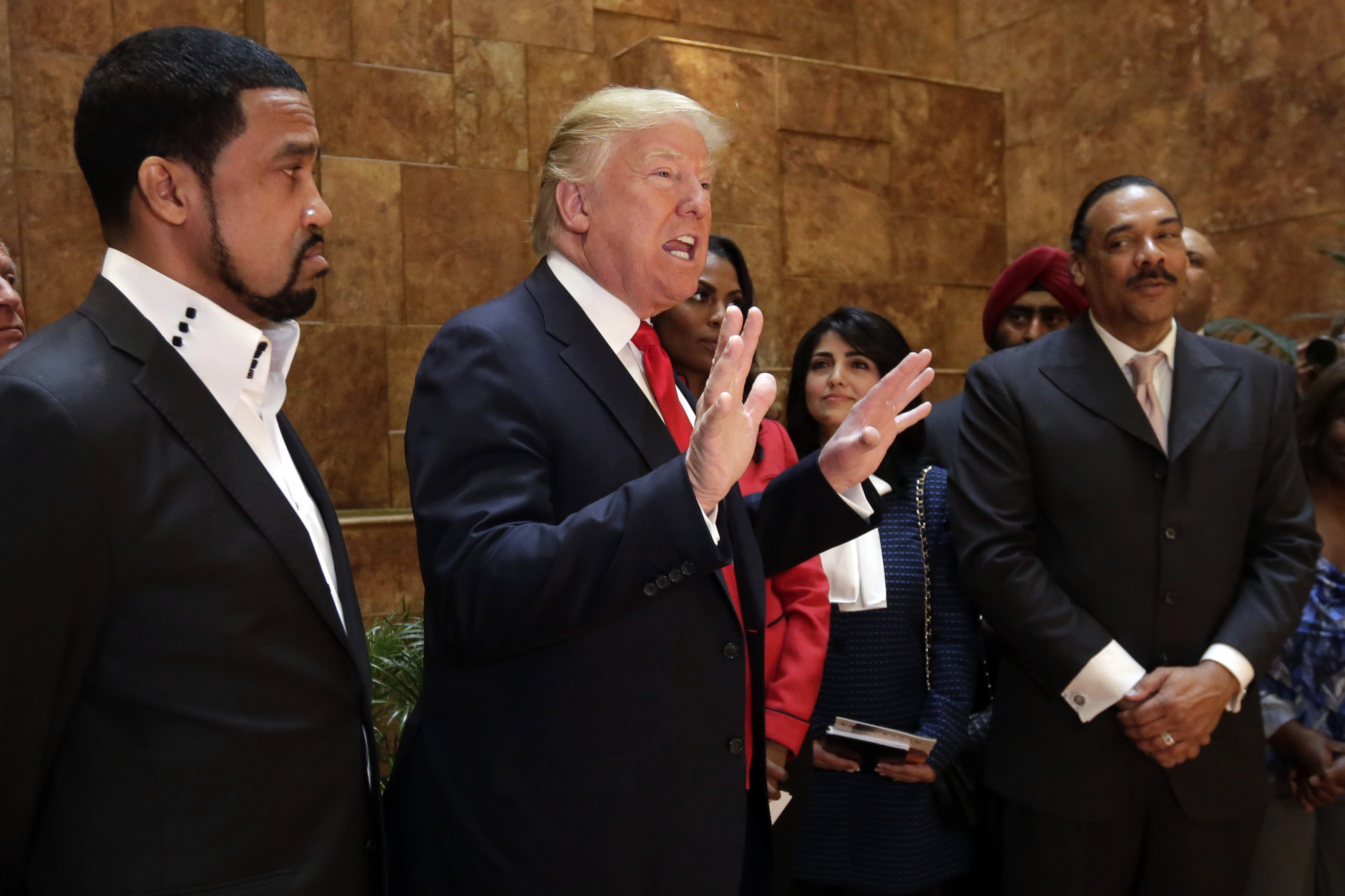 In this April 18, 2016 file photo, Pastor Darrell Scott listens at left as Republican presidential candidate Donald Trump speaks in Trump Tower building in New York. Competing appearances earlier this month by Trump and Hillary Clinton highlight an oft-overlooked political reality: The “religious vote” is vast and complex, and it extends beyond generalizations about “social conservatives” who side with Republicans and black Protestant churches whose pastors and parishioners opt nearly unanimously for Democrats. | AP Photo/Richard Drew, File; St. George News