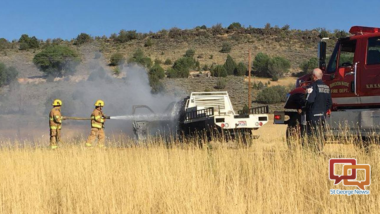 Firefighters work to put out a vehicle fire on state Route 18 Tuesday afternoon. Veyo, Utah, Aug. 9, 2016 | Photo courtesy of Kathie Mason, St. George News