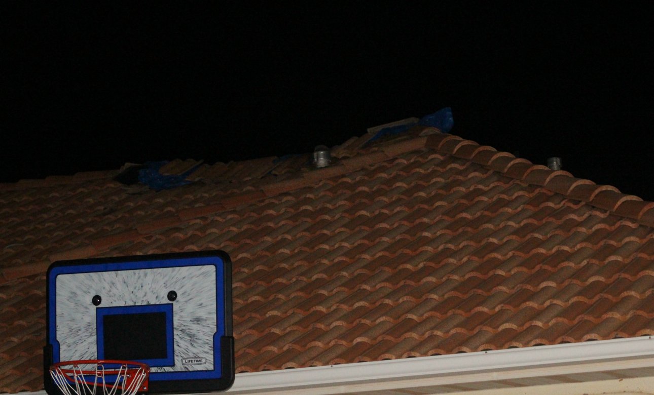 A tarp held down by broken roof tile shows the spot where lightning struck a home in Ivins and blew a hole in the roof, Ivins, Utah, Aug. 23, 2016 | Photo by Mori Kessler, St. George News