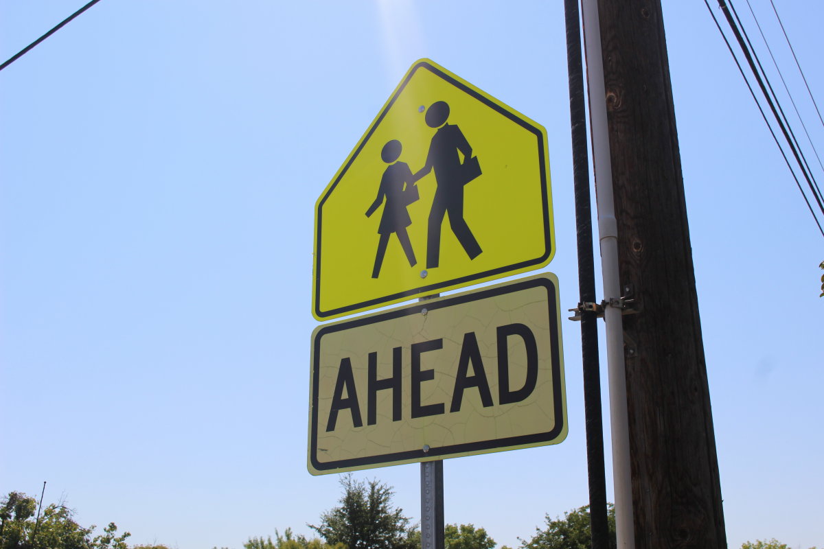 A street sign notifying motorists of the crosswalk at the intersection of 700 South and 600 East in St. George, Utah, Aug. 23, 2016 | Photo by Mori Kessler, St. George News