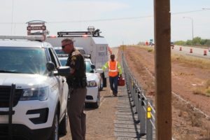 Responders line up in the right hand emergency lane with Todd Royce from UDOT bringing gas for the Jeep on Interstate 15 in Washington, Utah, Aug. 18, 2016 | Photo by Cody Blowers, St. George News