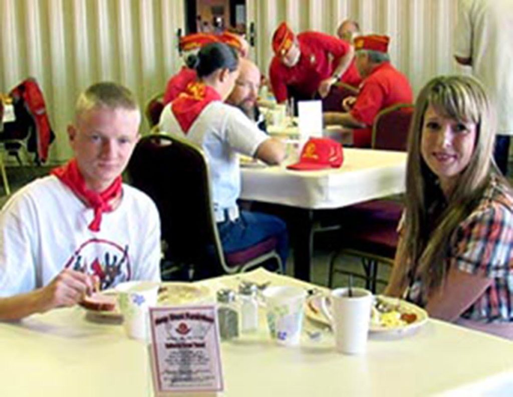 L-R foreground: Braxston Summers enjoys the breakfast at the Elks Lodge with his mother, St. George, Utah, | 