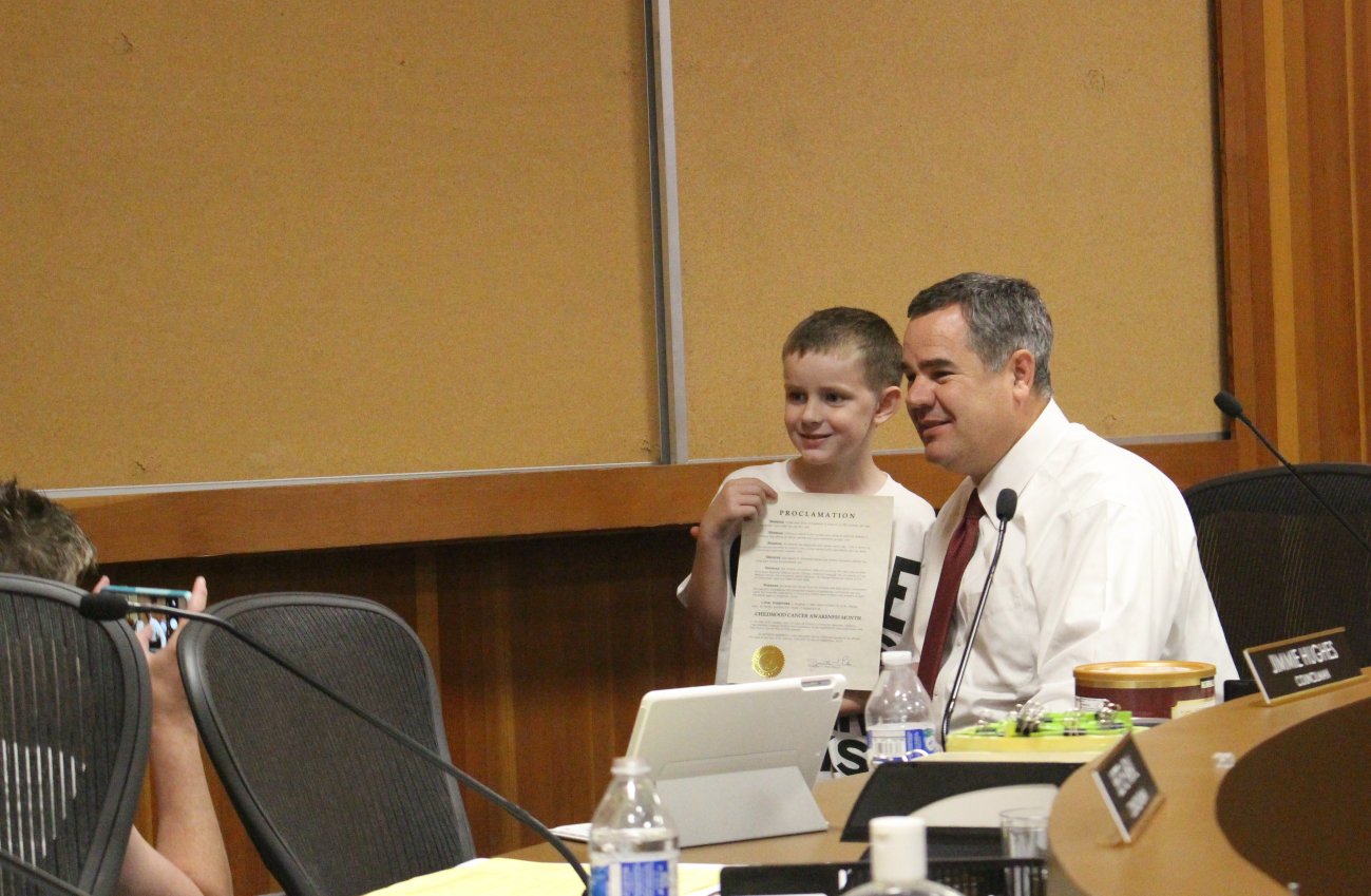 George Stafford posing for a photo with St. George Mayor Jon Pike as he holds up the proclamation from the city recognizing September as Childhood Cancer Awareness Month, St. George, Utah, Sept. 1, 2016 | Photo by Mori Kessler, St. George News