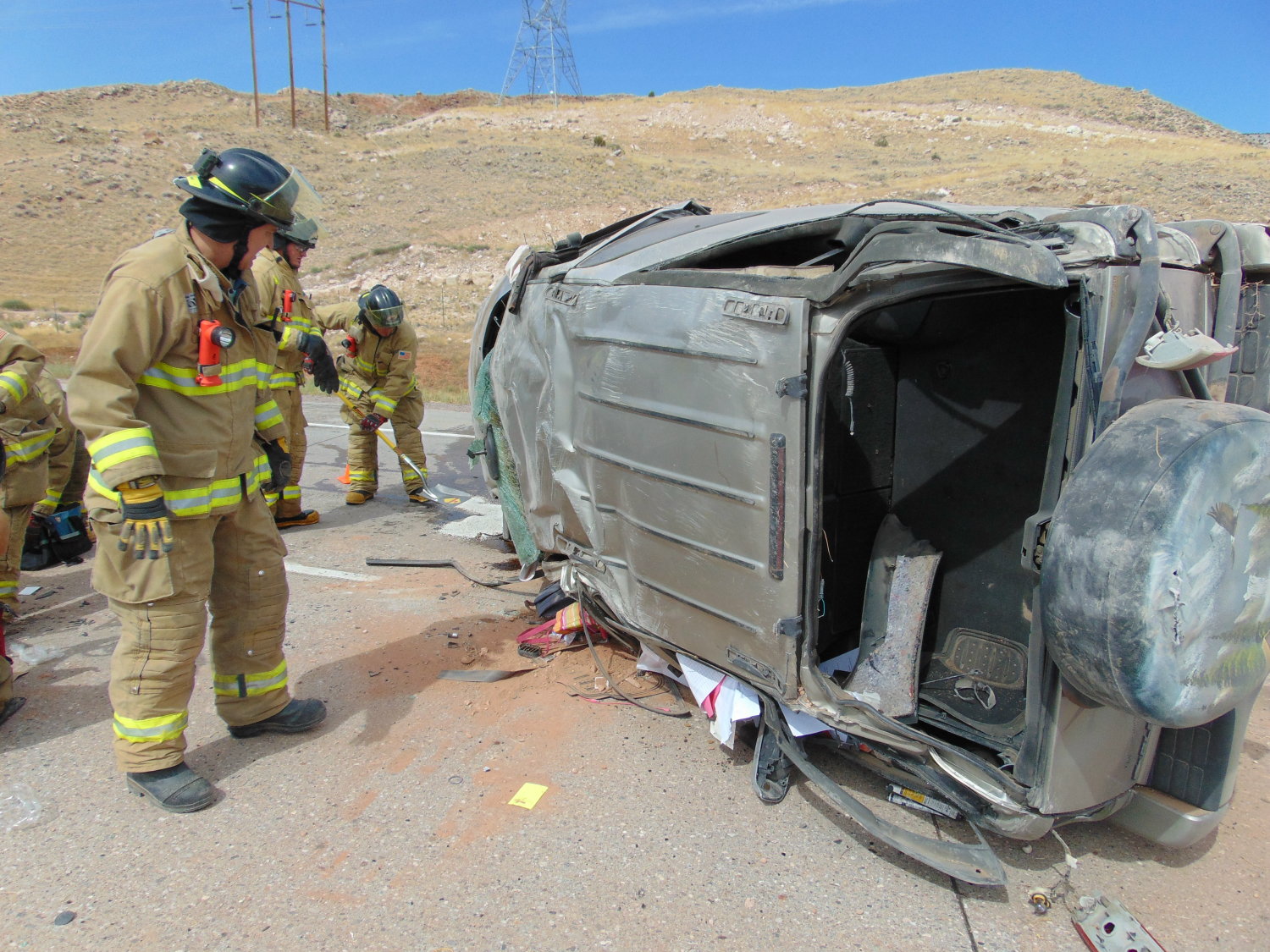 First responders tend to a single-vehicle rollover on Interstate 70 near milepost 39. The rollover left a 19-year-old woman critically injured and is under investigation by the Utah Highway Patrol, Sevier County, Utah, Sept. 5, 2016 | Photo courtesy of the Utah Highway Patrol, St. George News