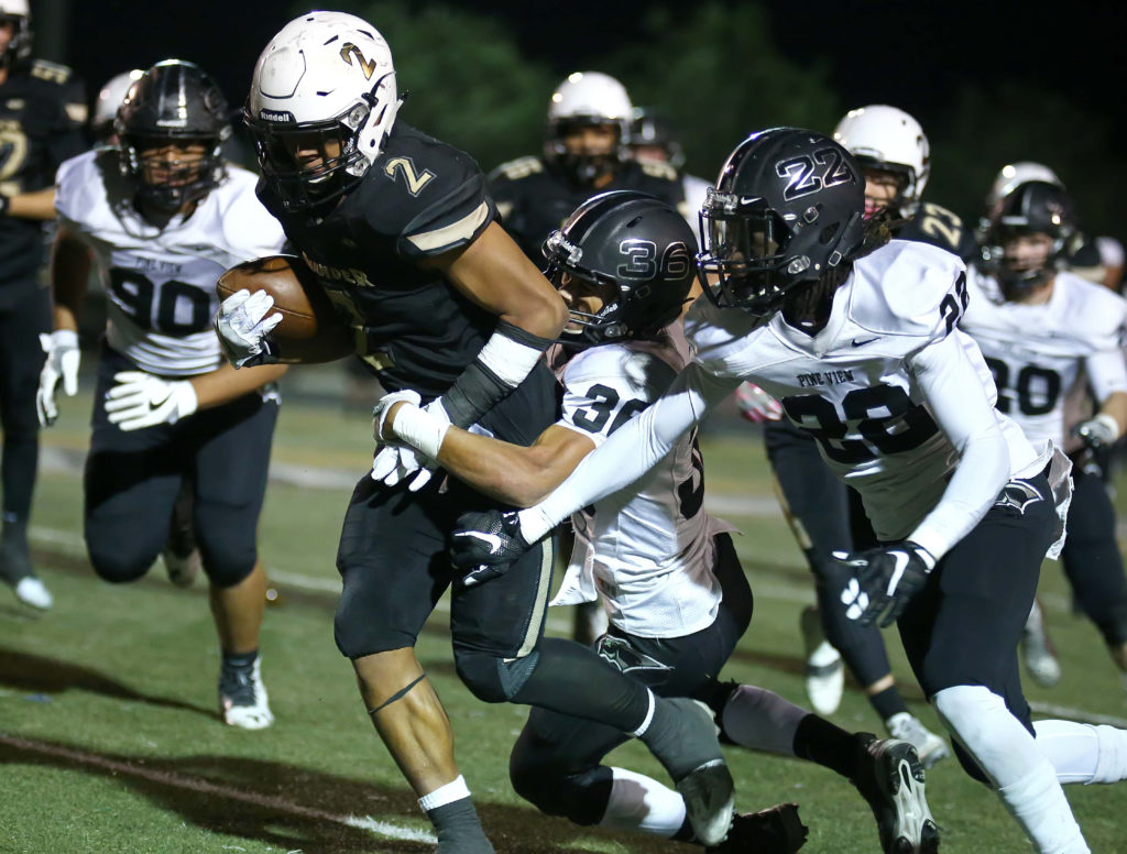 Desert Hills’ Nephi Sewell (2) makes some tough yards, Desert Hills vs. Pine View, Football, St. George, Utah, Oct. 7, 2016, | Photo by Robert Hoppie, ASPpix.com, St. George News