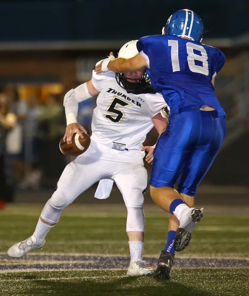 Dixie's Tyson Fisher (18) sacks Desert Hills quarterback Quinn Kiser (5), Dixie vs. Desert Hills, Football, St. George, Utah, Sept. 30, 2016, | Photo by Robert Hoppie, ASPpix.com, St. George News