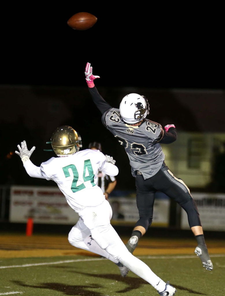 Desert HillsÕ Logan Hokanson (23) and Snow Canyon's Tyson Harvey (24), Desert Hills vs. Snow Canyon, Football, St. George, Utah, Oct. 21, 2016, | Photo by Robert Hoppie, ASPpix.com, St. George News