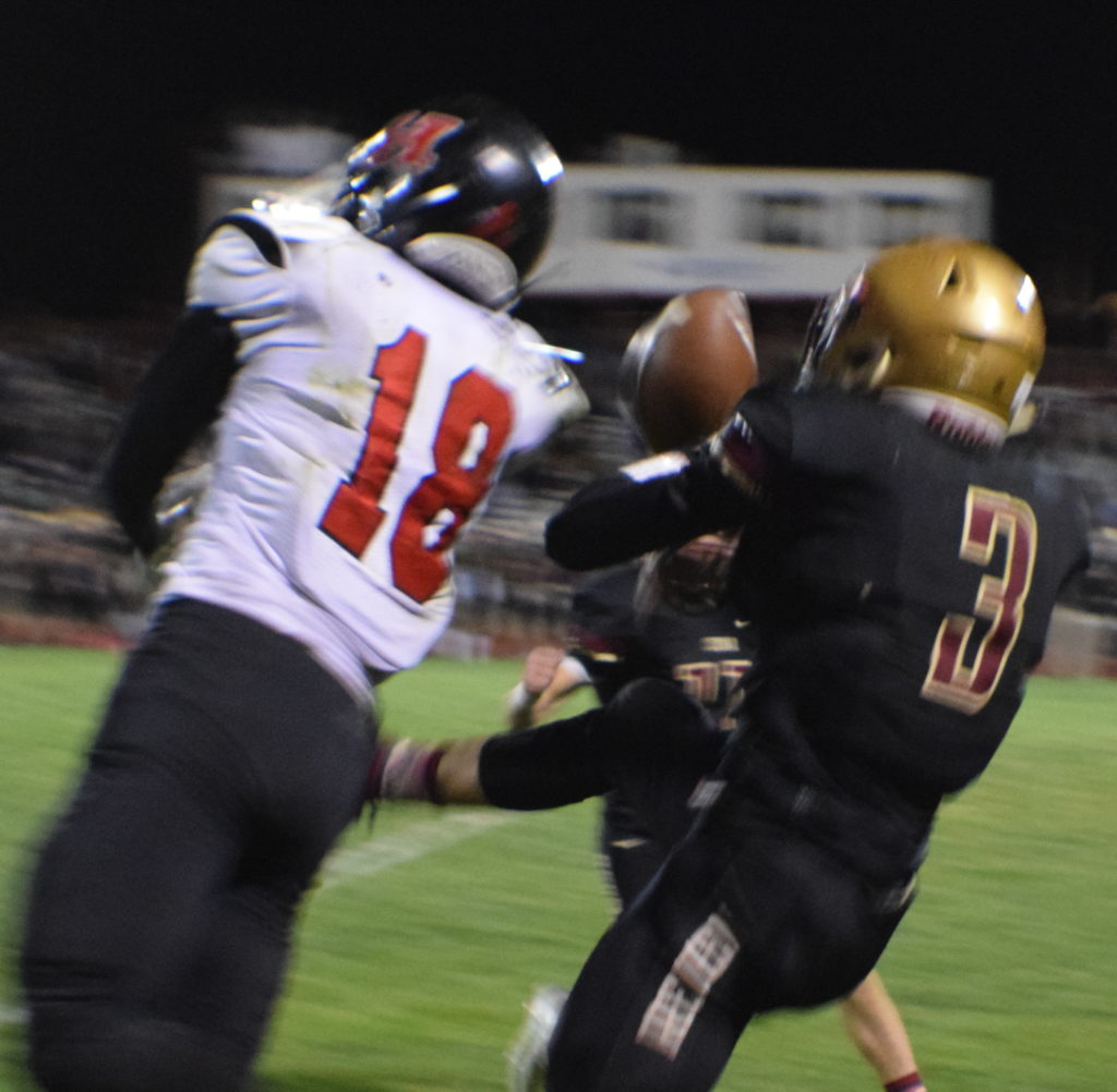 Tobie Swenson (18) and Braden Garrett (3), Hurricane vs. Cedar, Cedar City, Utah, Oct. 7, 2016 | Photo by Katina Young, for St. George News