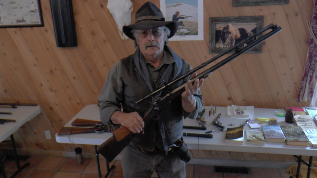 Firearms instructor and Silver Reef Museum guide showcases some of his private gun collection at the Old Cosmopolitan building in the Silver Reef area of Leeds, Utah, date not specified | Photo courtesy of the Silver Reef Foundation, St. George News