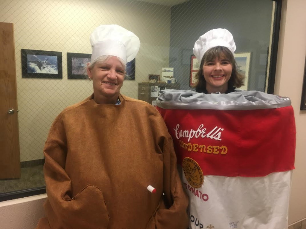 L-R: Linda Wallace (Team Blue) and Brandy Adams (Team Red) show off their costumes for the RAM Company's employee food drive, St. George, Utah, Nov. 20, 2016 | Photo by Hollie Reina, St. George News