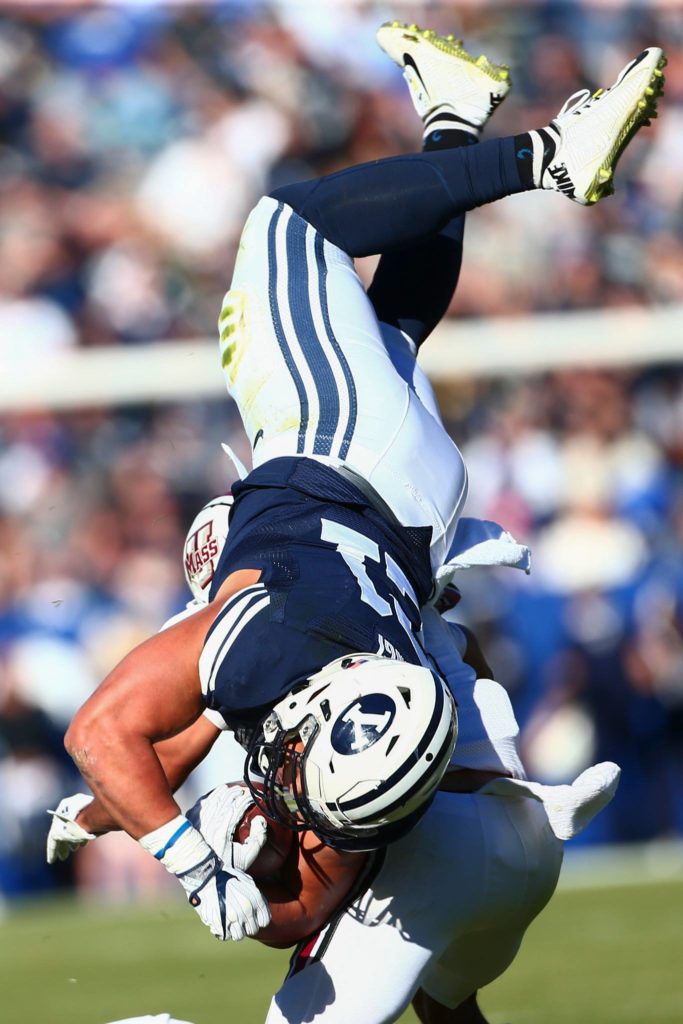 Harvey Langi is upended, BYU vs. Massachusetts, Provo, Utah, Nov. 19, 2016 | Photo by BYU Photo