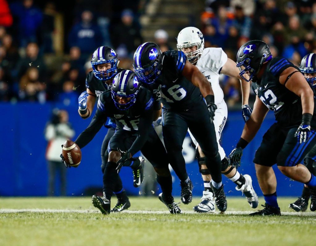 Michael Shelton scoops up a fumble and scores Saturday night, BYU vs. Utah State, Provo, Utah, Nov. 26, 2016 | Photo by BYU Photo