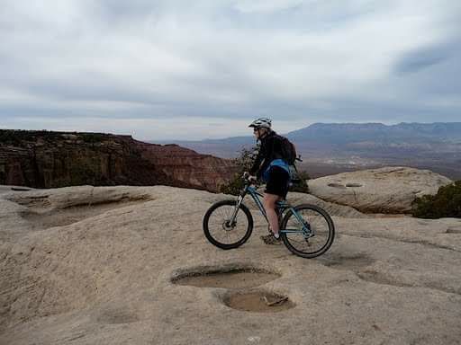 Wendy West stops to enjoy the view on the Gooseberry Mesa Trail near Apple Valley, Utah, Nov. 25, 2016 | Photo courtesy of Cassy Jones, St. George News