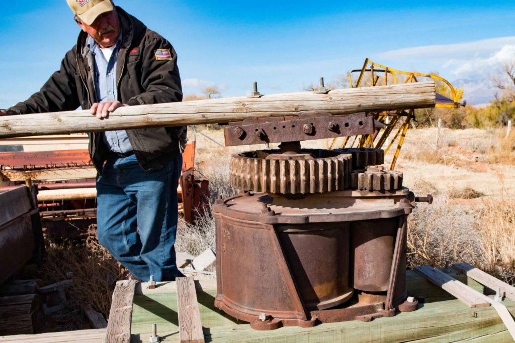 John Kirkland demonstrates an older sorghum squeezing mill that was operated by a team of horses, Washington, Utah, Dec. 12, 2016 | Photo by and courtesy of Jim Lillywhite, St. George News