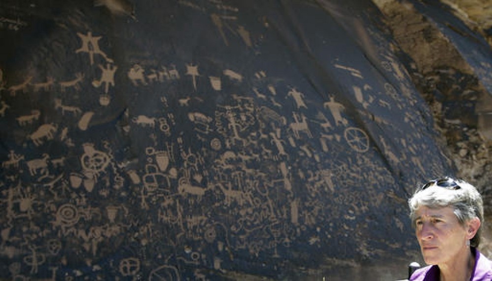 File photo: In this file photo, the Newspaper Rock featuring a rock panel of petroglyphs in the Indian Creek Area is shown to U.S. Interior Secretary Sally Jewell, near Monticello, Utah, during a tour to meet with proponents and opponents to the "Bears Ears" monument proposal. President Barack Obama designated two national monuments Wednesday, Dec. 28, at sites in Utah and Nevada that have become key flashpoints over use of public land in the U.S. West, Monticello, Utah, July 14, 2016 | AP Photo/Rick Bowmer, File, St. George News