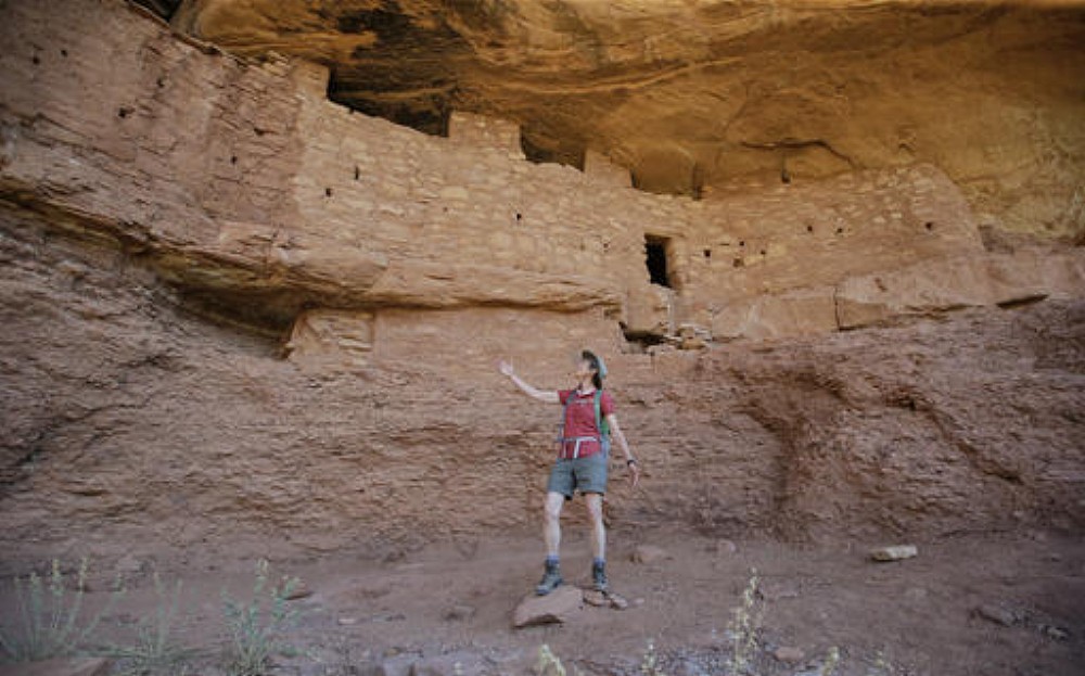 File photo: In this file photo:, U.S. Interior Secretary Sally Jewell looks at the "Moonhouse" in McLoyd Canyon, near Blanding, Utah, during a tour to meet with proponents and opponents to the "Bears Ears" monument proposal. President Barack Obama designated two national monuments Wednesday, Dec. 28, at sites in Utah and Nevada that have become key flashpoints over use of public land in the U.S. West, Blanding, Utah, July 15, 2016 | AP Photo/Rick Bowmer, File, St. George News