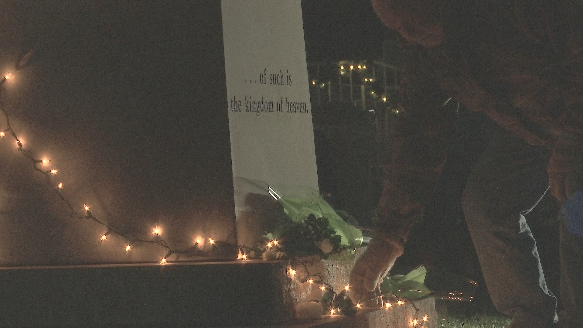 White roses laid at the base of the “Angel of Hope” statue that serves as the focus the Christmas Box Angel ceremony, an annual event meant to providing healing and support to parents of children who have passed away, regardless of age or circumstance, St. George, Utah, Dec. 6, 2016 | Photo by Sheldon Demke, St. George News