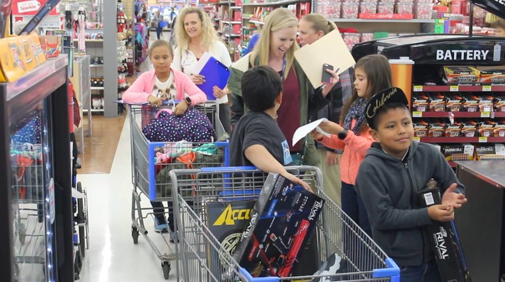 Participants in the "Shop With a Veteran" service activity get in line to make their purchases, St. George, Utah, Dec. 5, 2016 | Photo by Mike Cole, St. George News