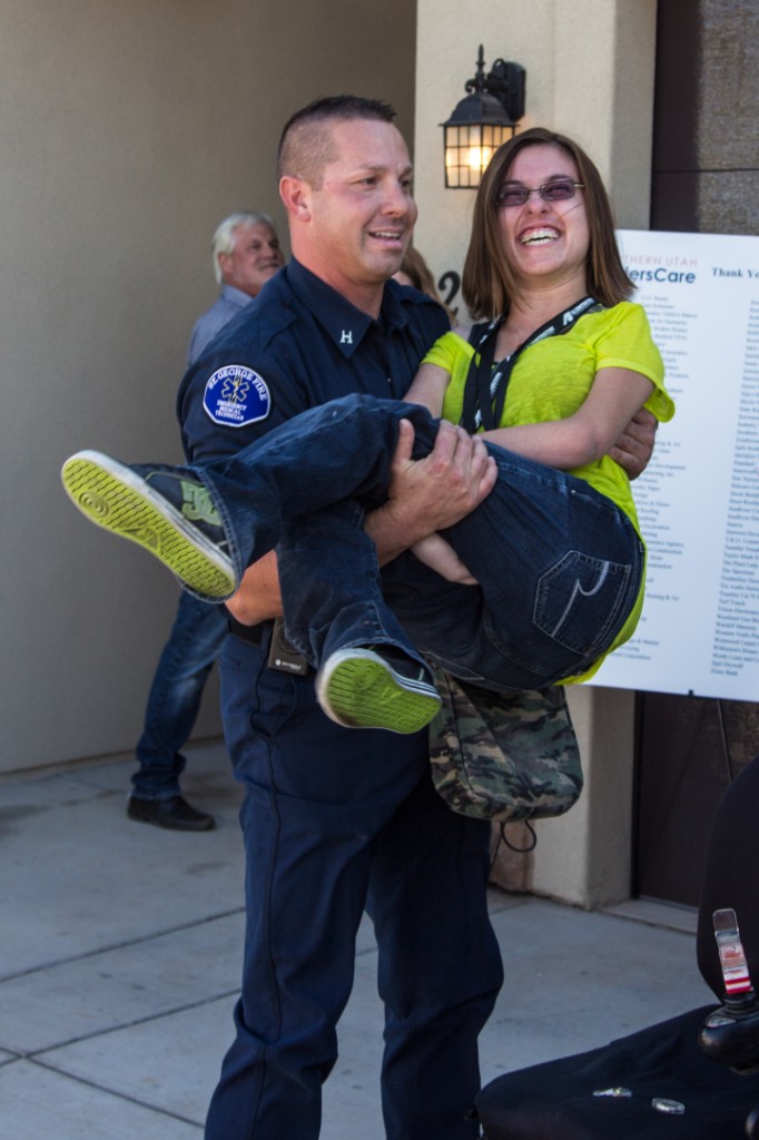 St. George fireman carries 'Sweet Lindsey' Smith over threshold over her new home | Home for Lindsey | Southern Utah Home Builders Association 2012 Care Project