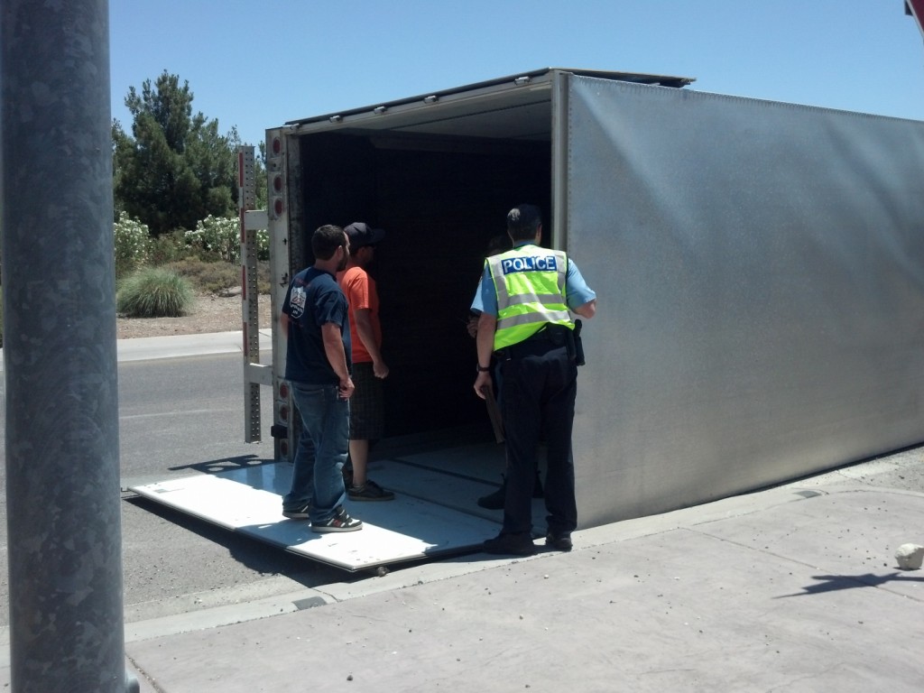 Crew from Brackens Auto Tech at overturned Moss semitrailer