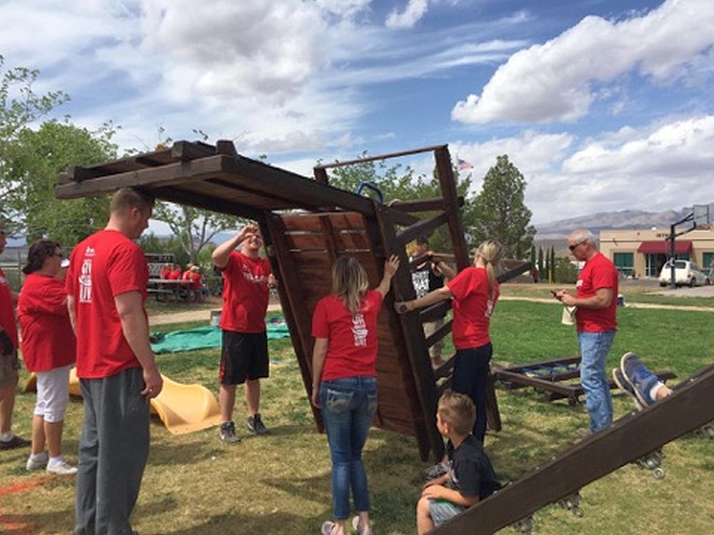 Keller Williams agents work on a playset at SwitchPoint