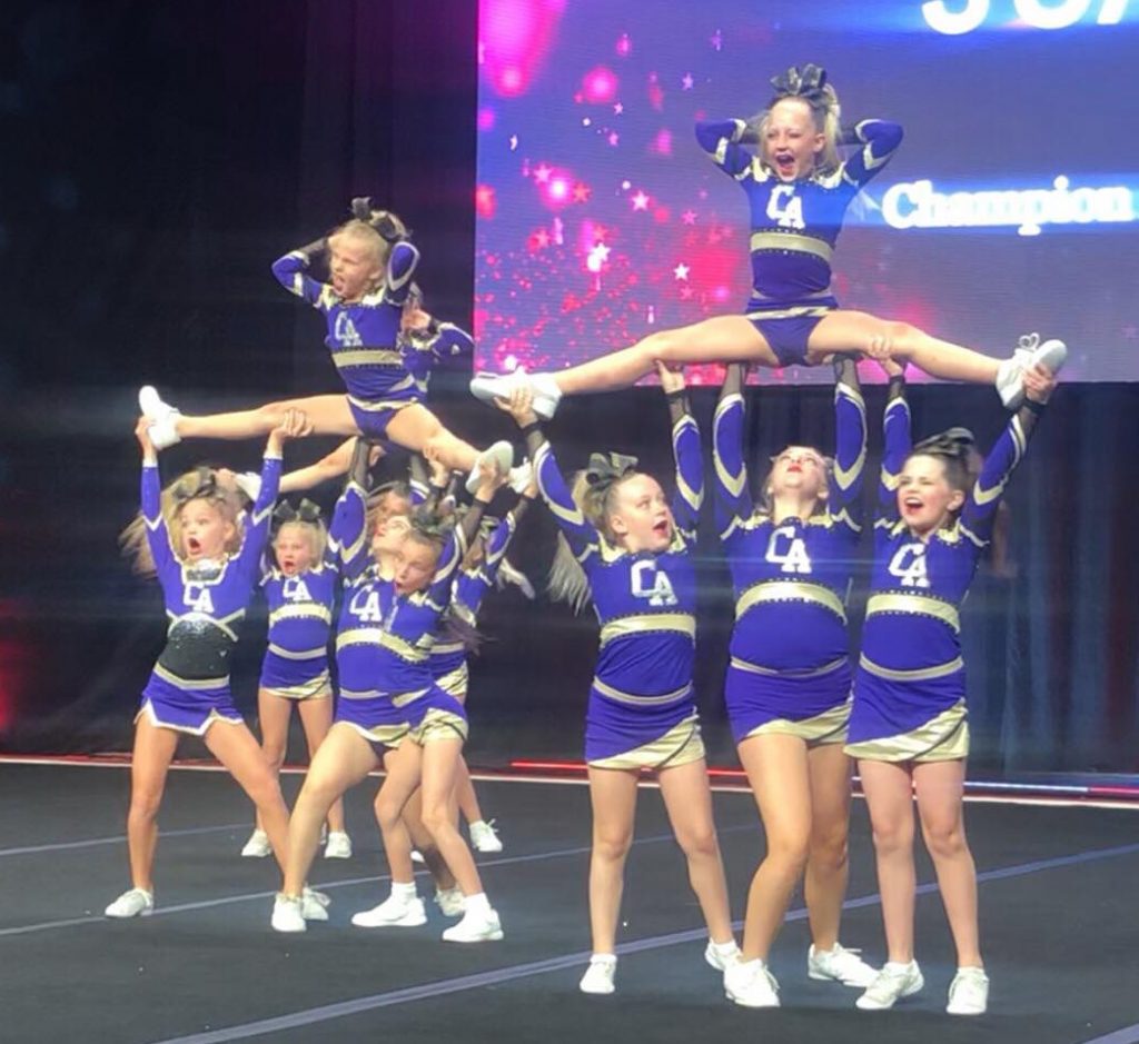 Young cheerleaders representing Champion Allstars gym in St. George, Utah, ...