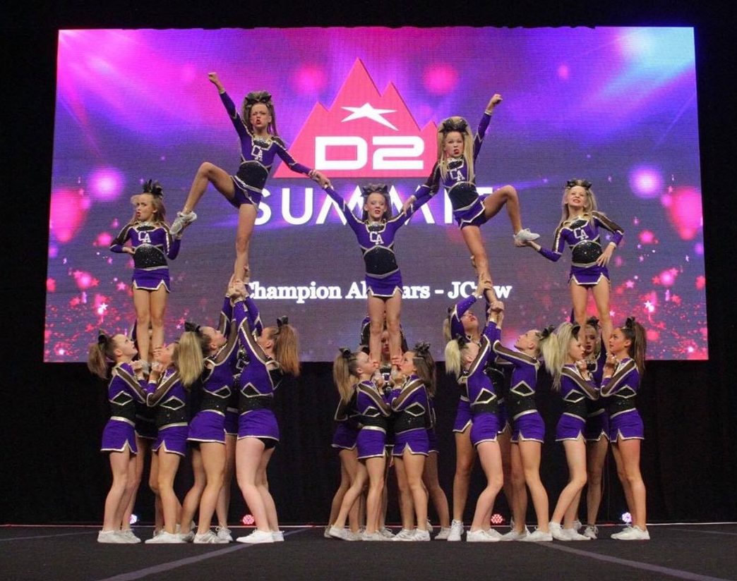 Young cheerleaders representing Champion Allstars gym in St. George, Utah, ...