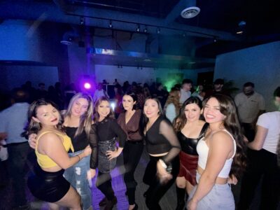 Attendees of a St. George Latin Dance Night pose on the dance floor, Date and location unspecified | Photo courtesy of Mercy Savaiinaea, St. George News