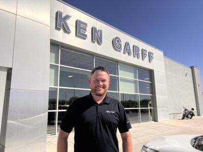 Austin Szatlocky, a marketing manager at Ken Garff St. George Ford, stands in front of the dealership, St. George, Utah, April 20, 2022 | Photo by Jessi Bang, St. George News